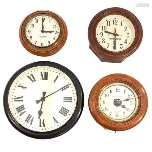 A Collection of 4 Electric Wall Clocks