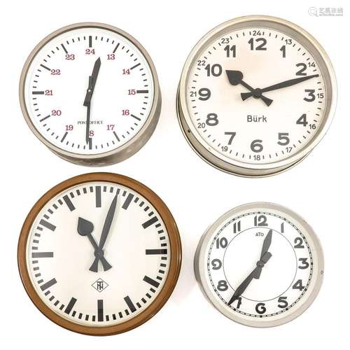 A Collection of 4 Electric Wall Clocks