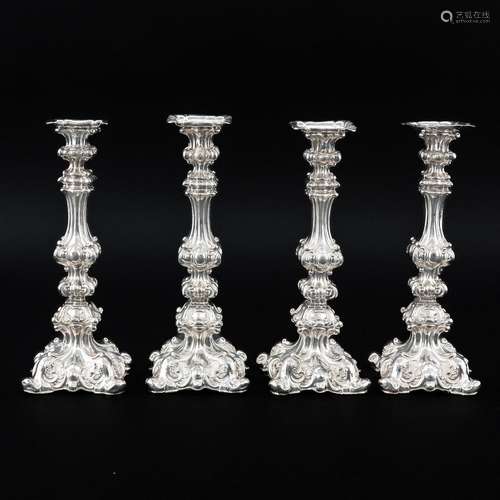 A Set of 4 Silver Candlesticks