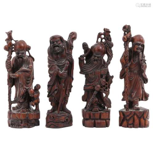 A Collection of 4 Carved Wood Sculptures