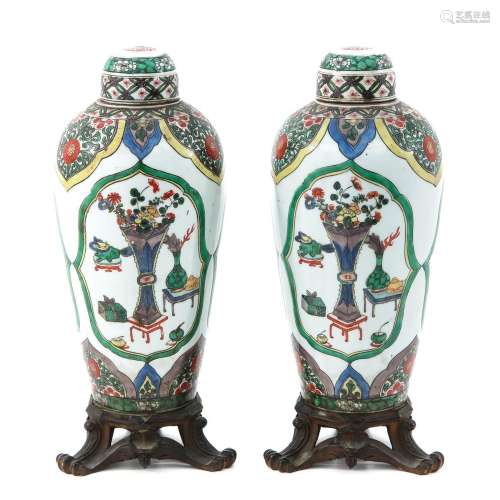 A Pair of Famille Verte Vases with Covers