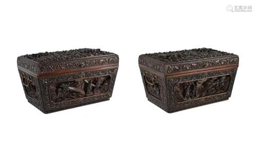 A pair of carved rosewood chests