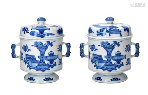 A pair of blue and white porcelain lidded jars with two ears