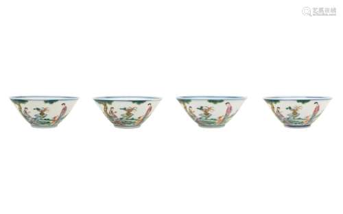 A set of four polychrome porcelain cups