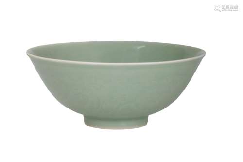 A finely incised celadon glazed 'floral scroll' bowl with un...