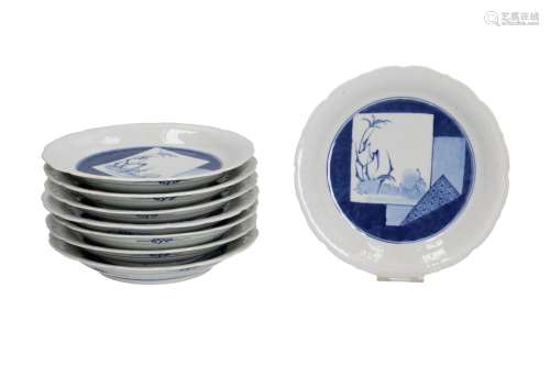 A set of eight blue and white porcelain saucers with scallop...