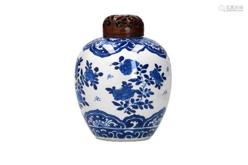 A blue and white porcelain jar with wooden cover, decorated ...