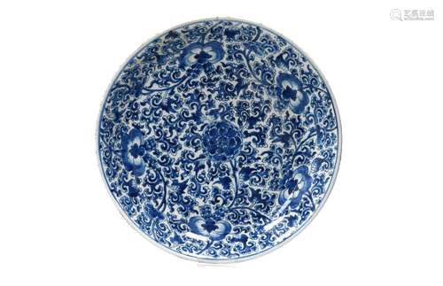 A blue and white porcelain charger, decorated with flowers