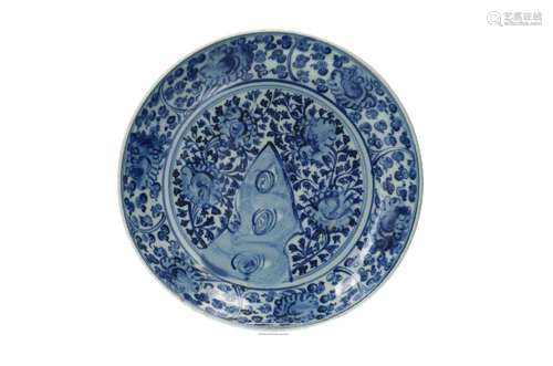 A blue and white porcelain charger, decorated with flowers