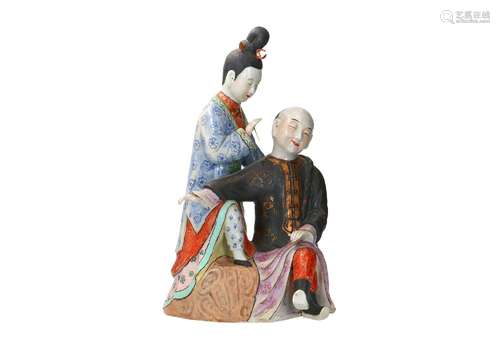 A polychrome porcelain sculpture, depicting a romantic scene