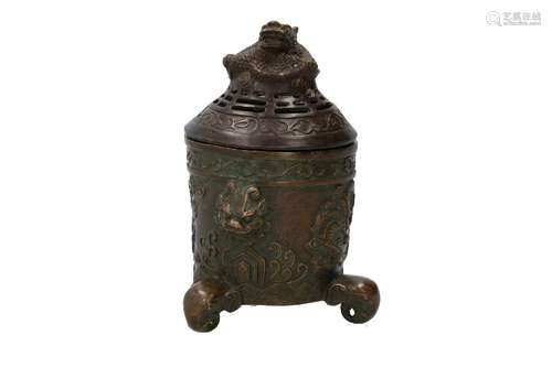 A bronze tripod lidded jar