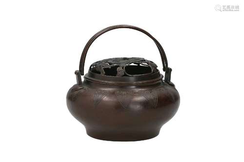 A bronze incense pot with a handle