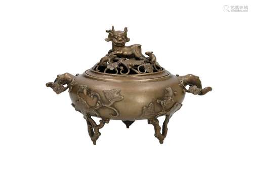 A bronze tripod censer with two grips and a cover, with open...