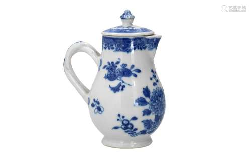 A blue and white porcelain lidded milk jug with a twisted do...