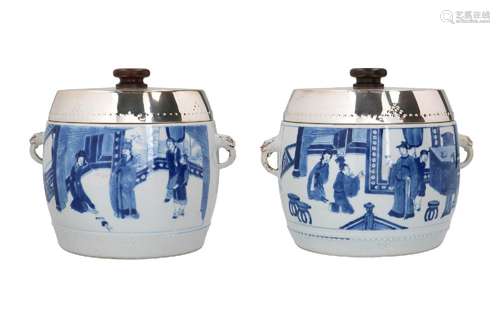 A pair of blue and white porcelain tureens with ears, decora...