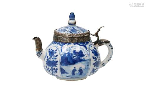 A blue and white porcelain teapot, decorated with flowers