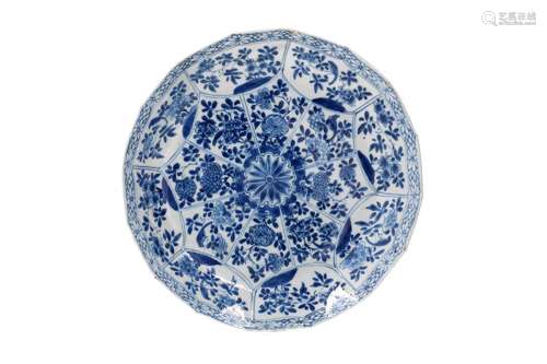 A lobed blue and white porcelain dish, decorated with reserv...