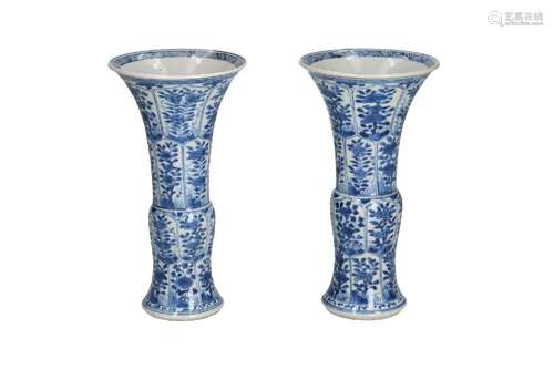 A pair of blue and white porcelain beaker vases, decorated w...