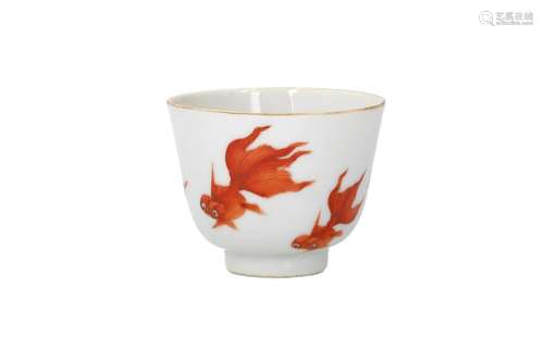 A white and iron red porcelain cup, decorated with goldfish