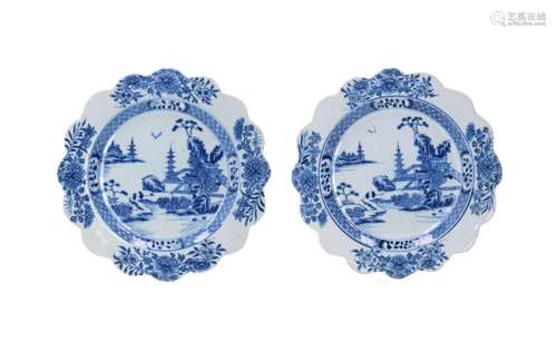 A pair of blue and white porcelain dishes with scalloped rim...