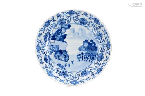 A blue and white porcelain dish with lobed and scalloped rim...