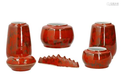 A six-piece orange glazed porcelain scolar set, including a ...