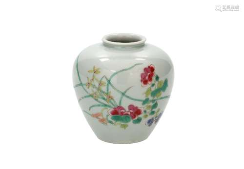 A polychrome porcelain jar, decorated with flowers and butte...