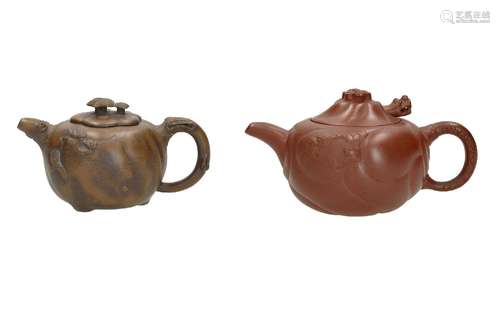 Lot of two Yixing teapots, 1) with relief decor of dragons a...