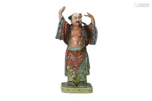 A polychrome porcelain sculpture, depicting a man