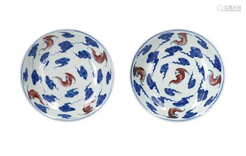 A pair of blue and copper red porcelain dishes, decorated wi...