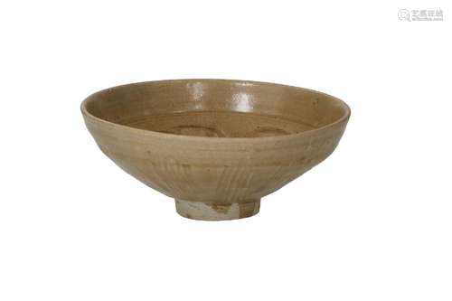 A brown glazed bowl with ribbed decor