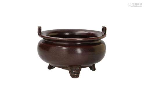 A celadon brown glazed tripod censer with two handles