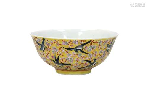 A famille jaune porcelain bowl, decorated with magpies and p...