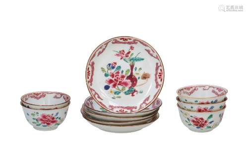 A set of five famille rose cups with saucers, decorated with...