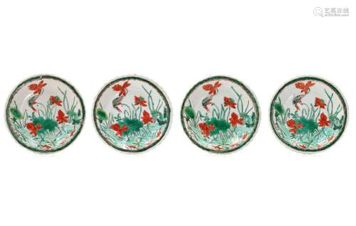 A set of four famille verte on capucine fond dishes with sca...