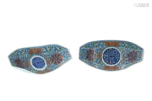 A pair of doucai porcelain bowls in the shape of boats, deco...