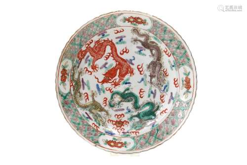 A polychrome porcelain dish, decorated with flowers and drag...