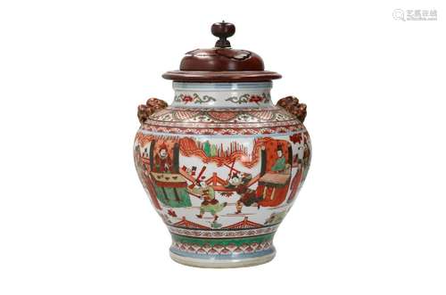 A wucai porcelain vase with grips in the shape of lion heads...