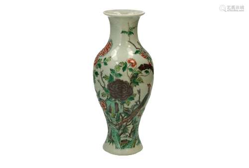 A famille verte porcelain vase, decorated with a peacock and...