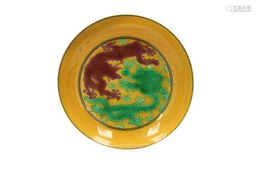 An emaille sur biscuit saucer, decorated with dragons chasin...