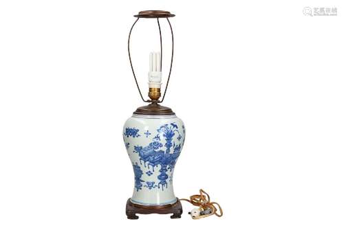 A blue and white porcelain vase, made into a lamp, decorated...