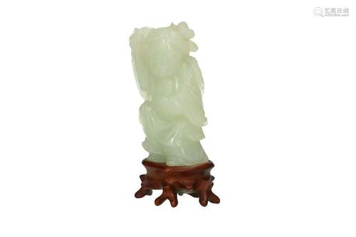 A carved jade sculpture on wooden base, depicting a standing...