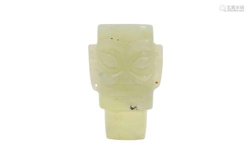 A jade pendant in the shape of a mask