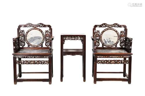 A pair of rosewood armchairs inlaid with mother-of-pearl and...