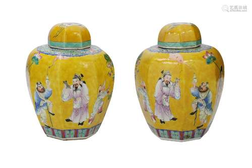 A pair of famille jaune porcelain lidded jars, decorated wit...