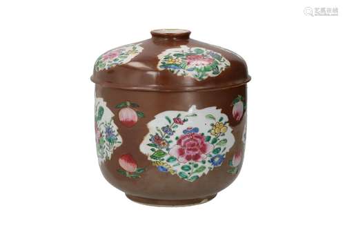 A capucine porcelain lidded jar, decorated with famille rose...