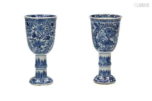 A pair of blue and white porcelain ribbed stem cups, decorat...