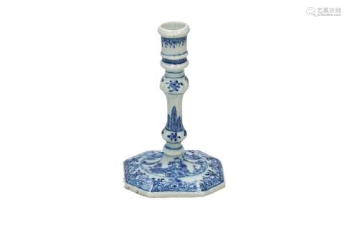 A blue and white porcelain candle stick, decorated with flow...