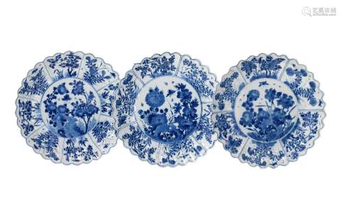 A set of three lobed blue and white porcelain dishes with sc...
