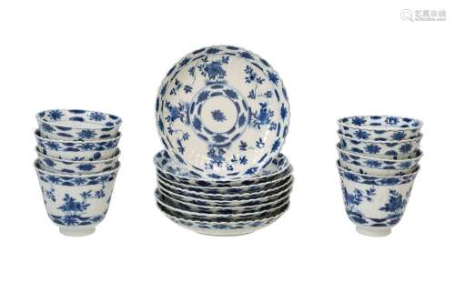 A set of eight blue and white lobed porcelain cups with sauc...